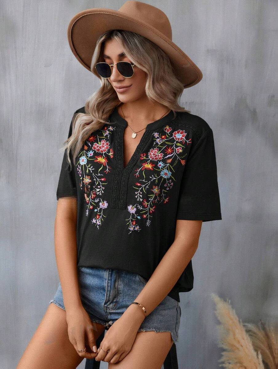 Blouse à broderies fleuries — noir